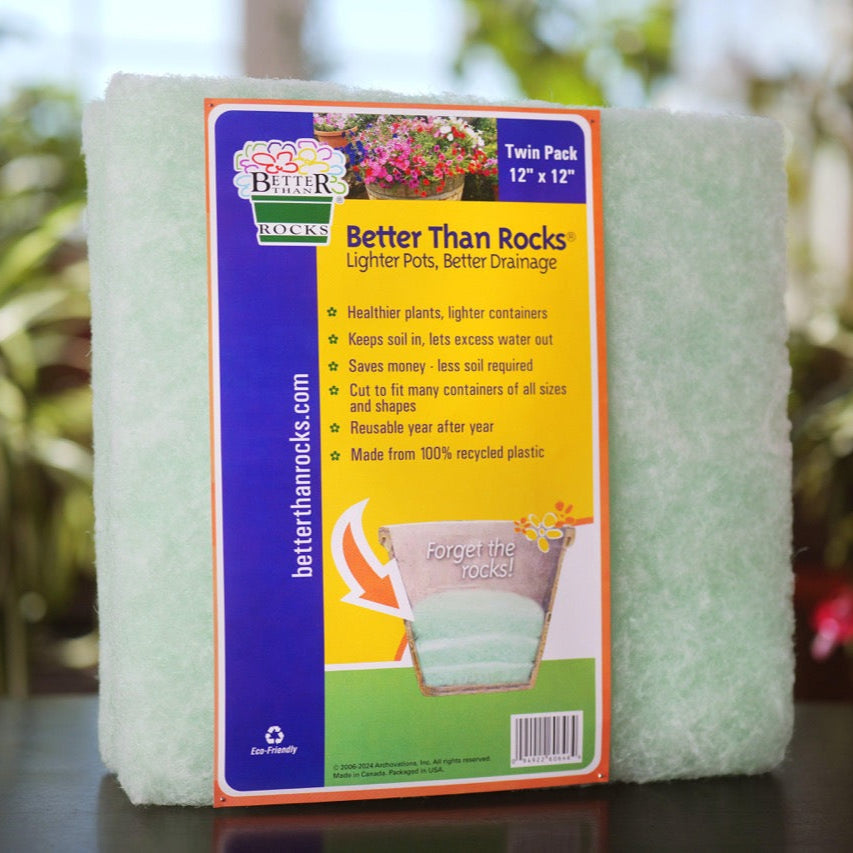Better Than Rocks 12&quot; × 12&quot; Twin Pack drainage insert displayed with flowers and large patio planters in an outdoor garden.