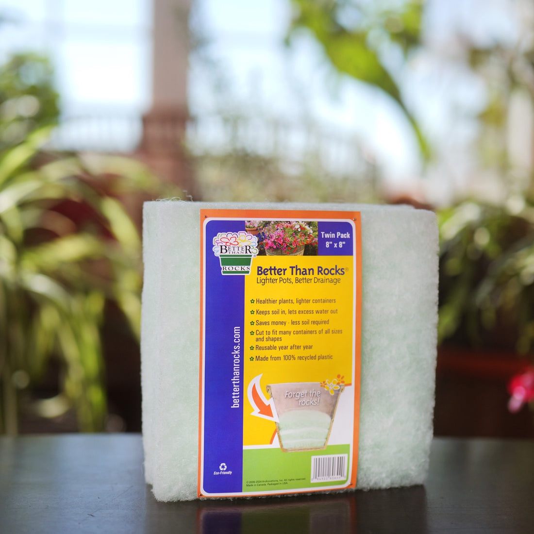 8&quot; × 8 &quot; Better Than Rocks Twin Pack drainage insert displayed on a patio table with indoor plants in the background.