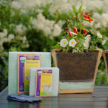 Better Than Rocks eco-friendly planter drainage sheets displayed beside a cutaway planter showing layered drainage setup, soil and blooming flowers — highlighting sustainable gardening in action. Featured sizes include the Better Than Rocks 8&quot; × 8&quot; Twin Pack and the Better Than Rocks 12&quot; × 12&quot; Twin Pack.